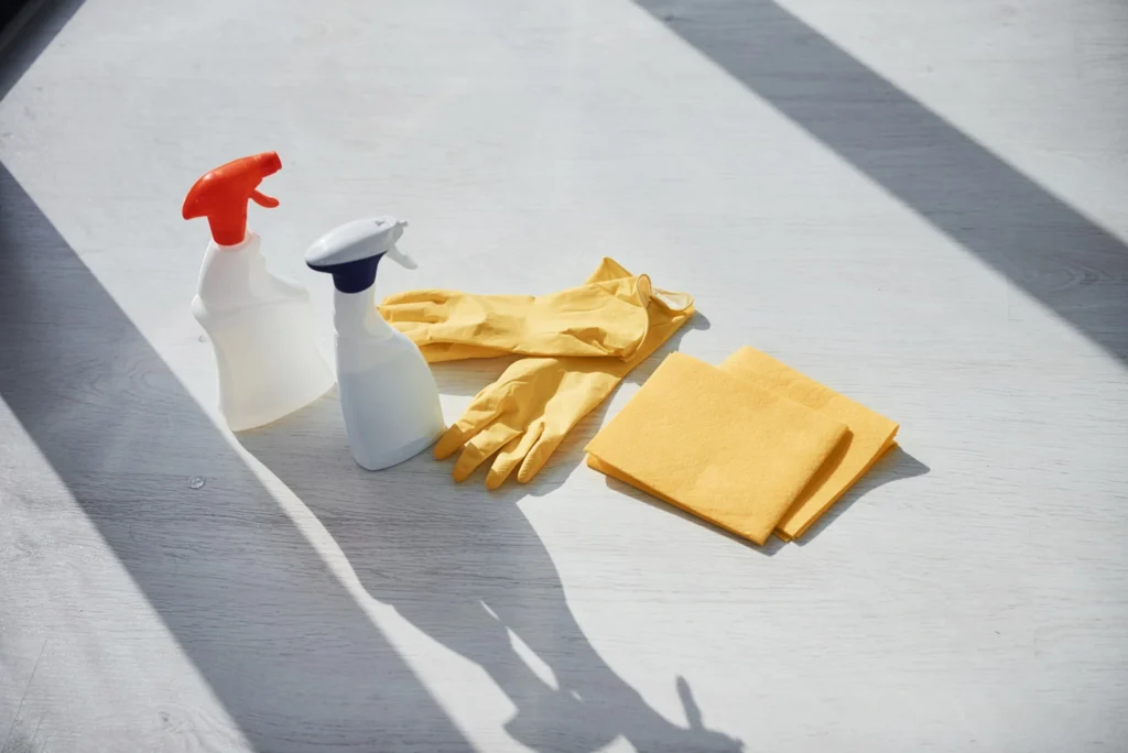 close-up-view-of-cleaning-spray-bottles-with-glove-2025-03-18-19-36-01-utc